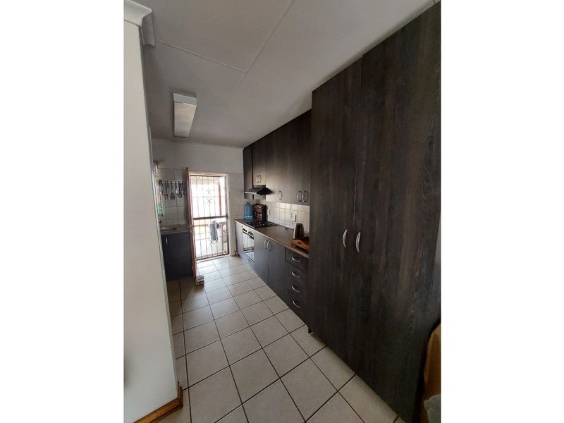 Charming Two-Bedroom Townhouse in Established Area - Photo 6