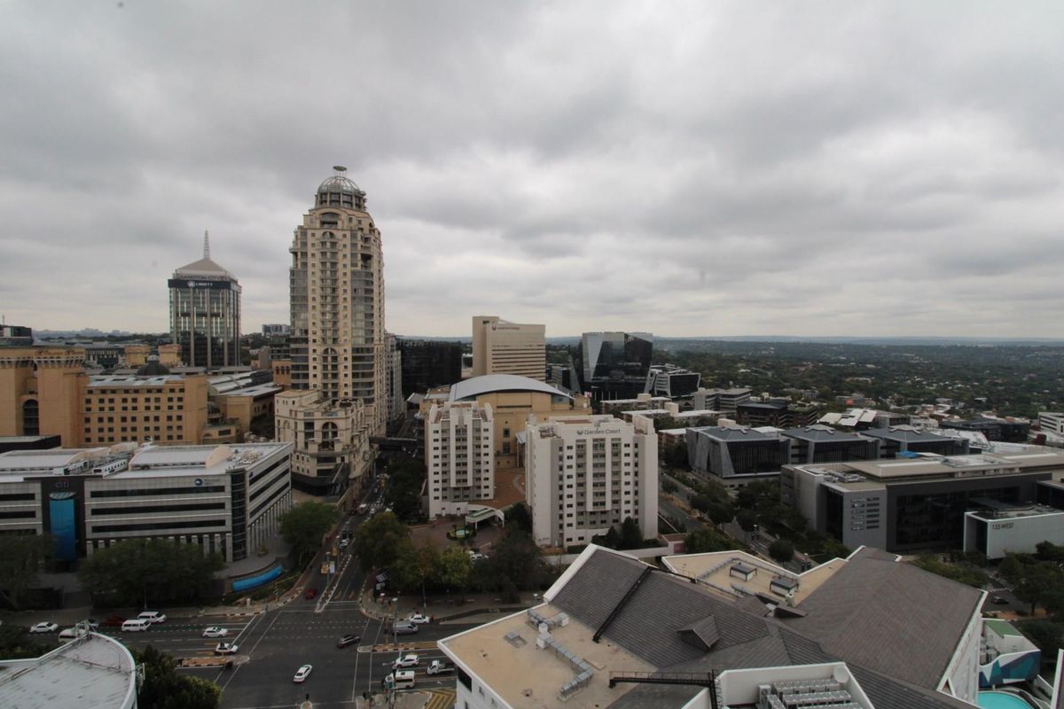 Elevated aerial view overlooking the surrounding urban cityscape and commercial district.
