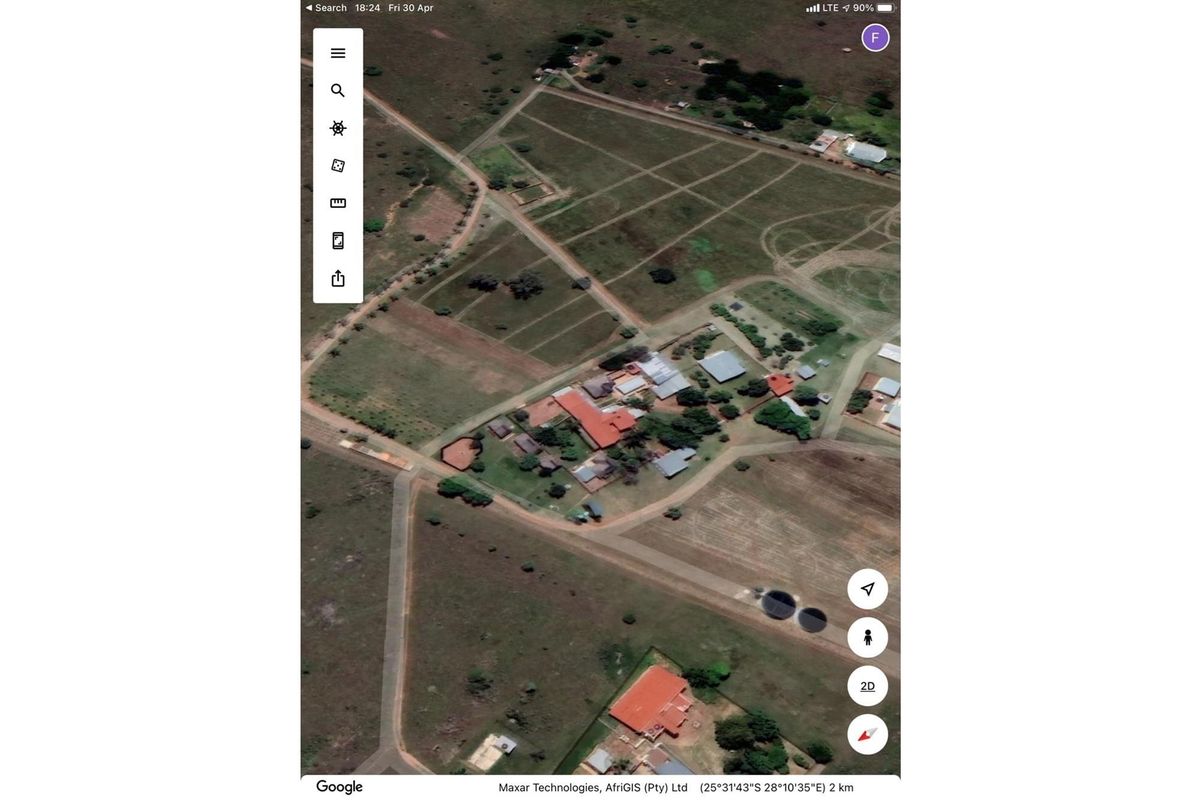 Aerial view of the farm property showing the main dwelling, outbuildings, and surrounding land layout.