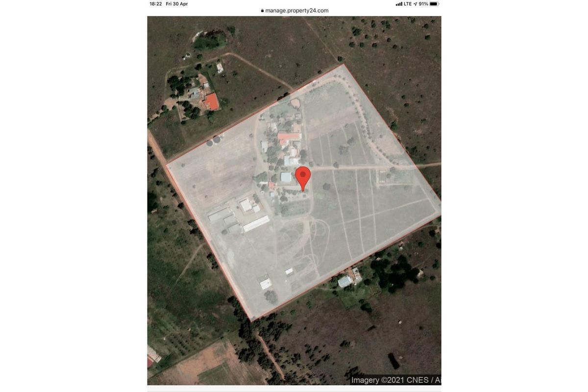 An aerial satellite view showing the layout and boundaries of the farm property.