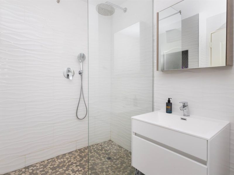 Secure and Modern 1-Bedroom Apartment in the Heart of Big Bay - Photo 10