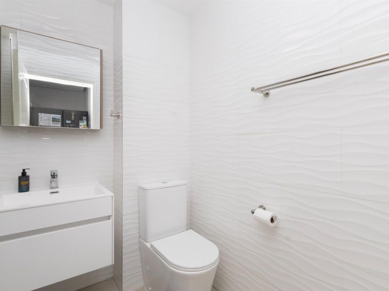 Secure and Modern 1-Bedroom Apartment in the Heart of Big Bay - Photo 9