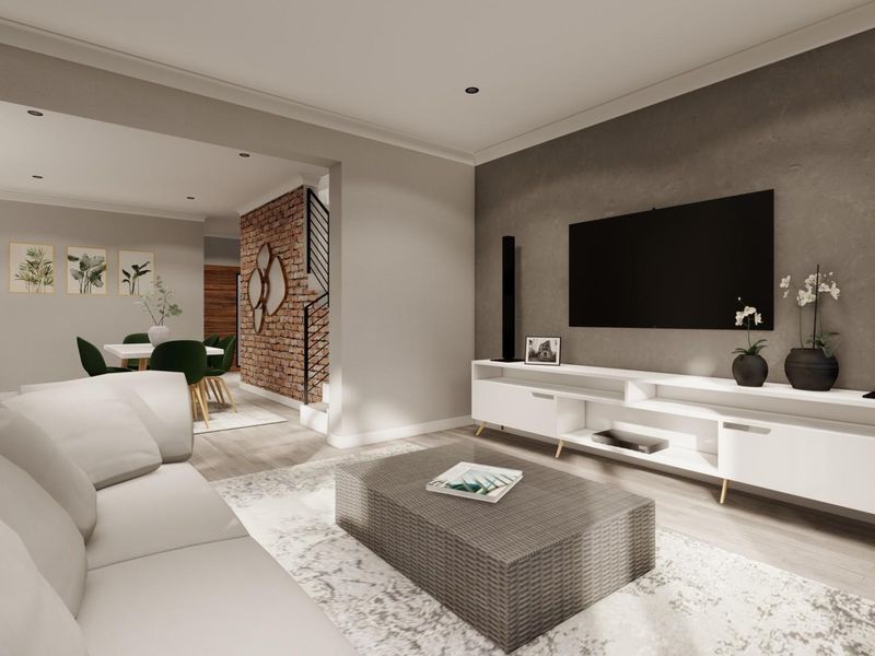 Modern open-plan living and dining area featuring an exposed brick feature wall, recessed lighting, and contemporary finishes throughout.
