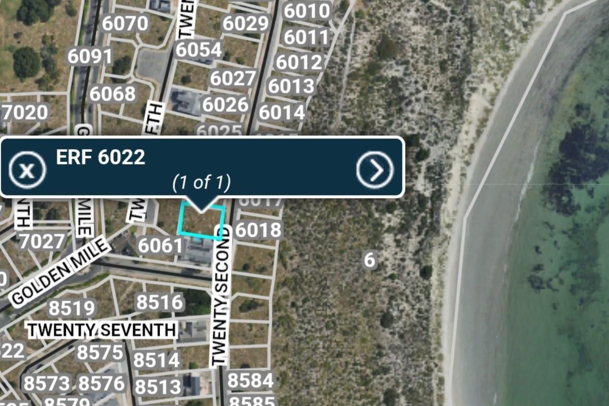An aerial map view showing the location of Erf 6022 within the surrounding residential neighborhood and coastal area.
