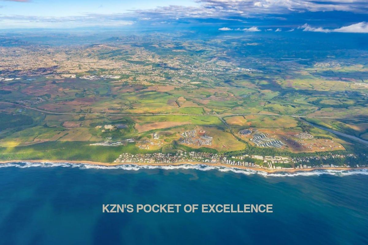 An expansive aerial view of the coastal landscape, showcasing the surrounding region and proximity to the ocean.