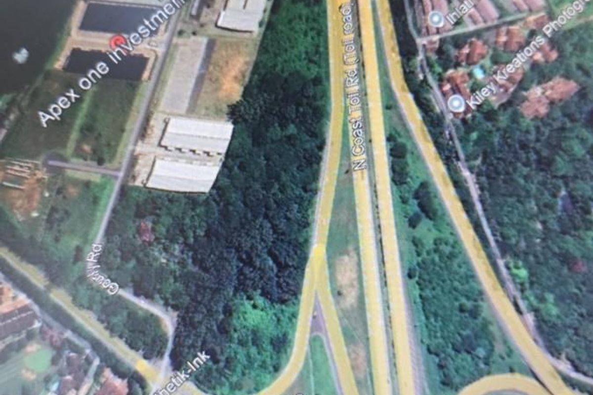 An aerial view of the agricultural land parcel showing its proximity to the N2 highway interchange and surrounding commercial and residential developments.