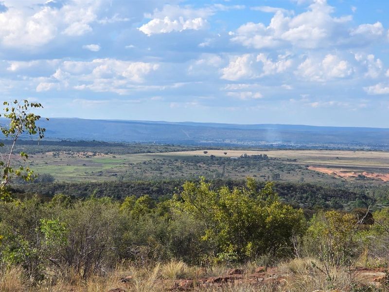 A scenic, elevated landscape view overlooking the surrounding natural terrain and distant horizon.