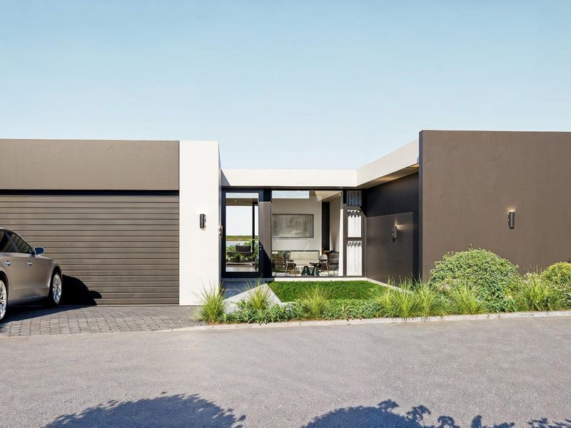 Modern single-story residential facade featuring a sleek dark and white exterior, integrated garage, and manicured front garden.