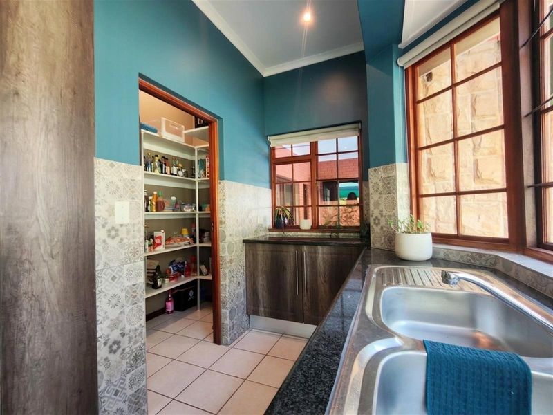 Modern Family Home with Flatlet, Pool and Greenbelt Views in Sought-After Estate - Photo 7