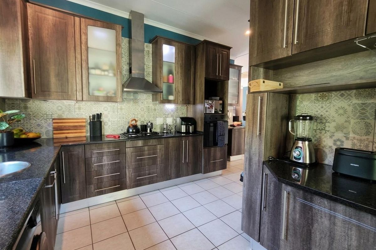 Modern Family Home with Flatlet, Pool and Greenbelt Views in Sought-After Estate - Photo 5