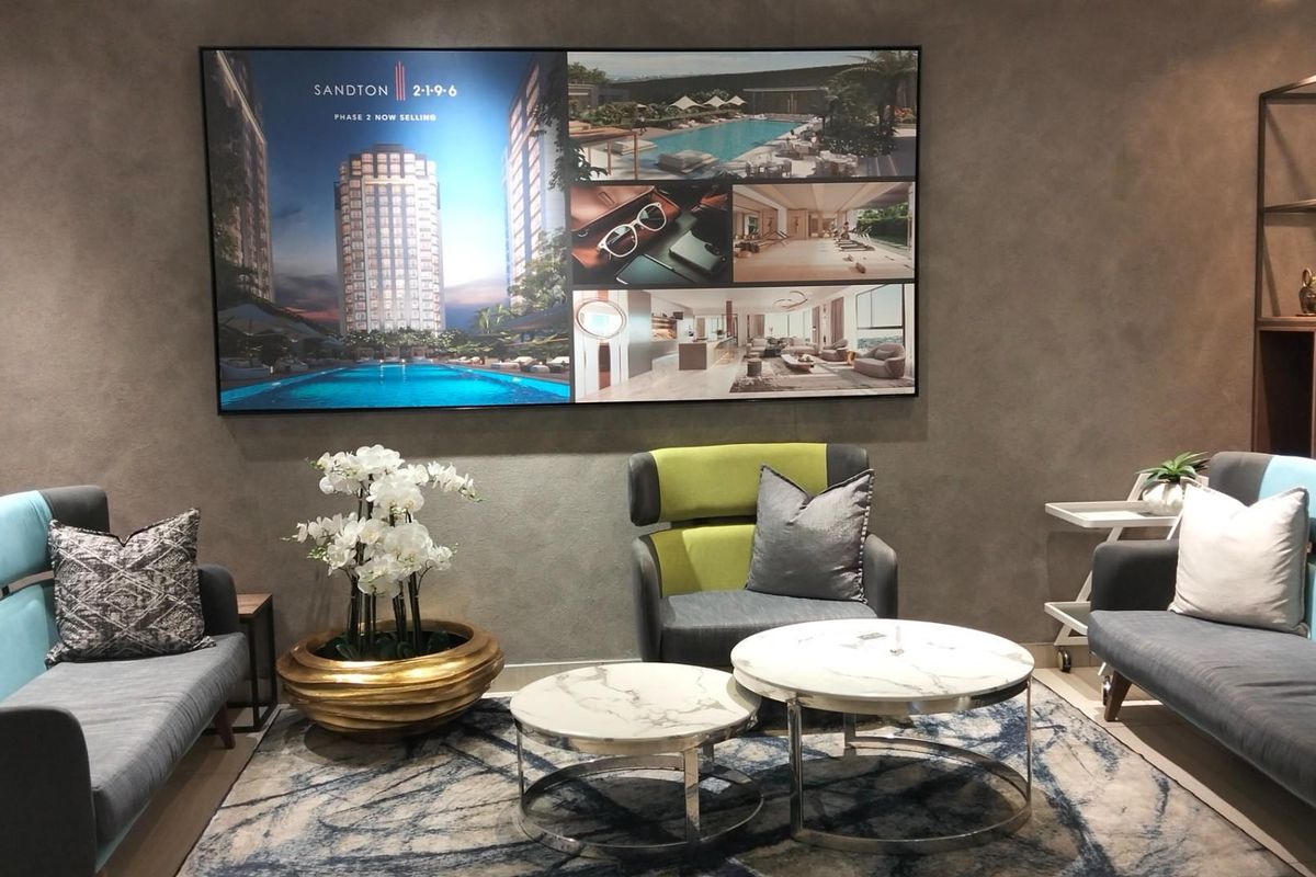 A modern, well-appointed lounge area featuring textured feature walls and contemporary interior design, suitable for a professional reception or residential common space.