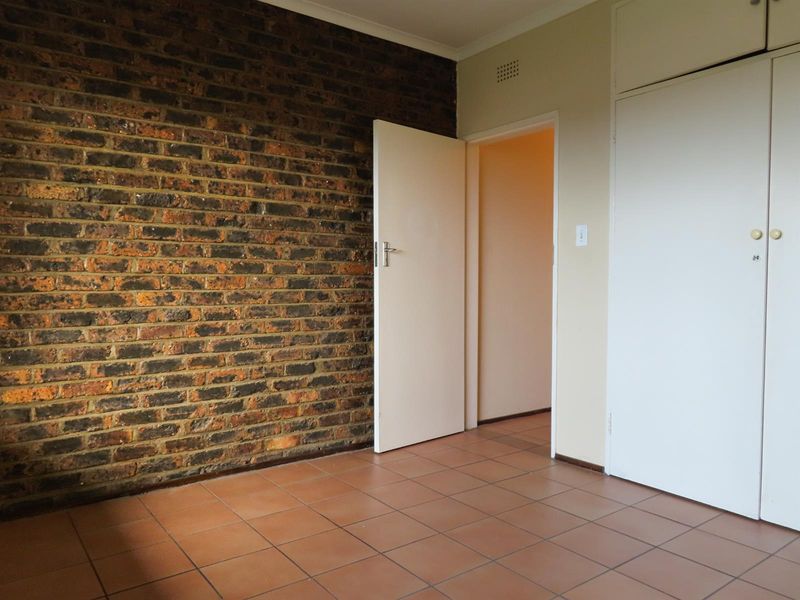 Sunny 2-Bedroom Home with Balcony in Well-Maintained Complex - Photo 5