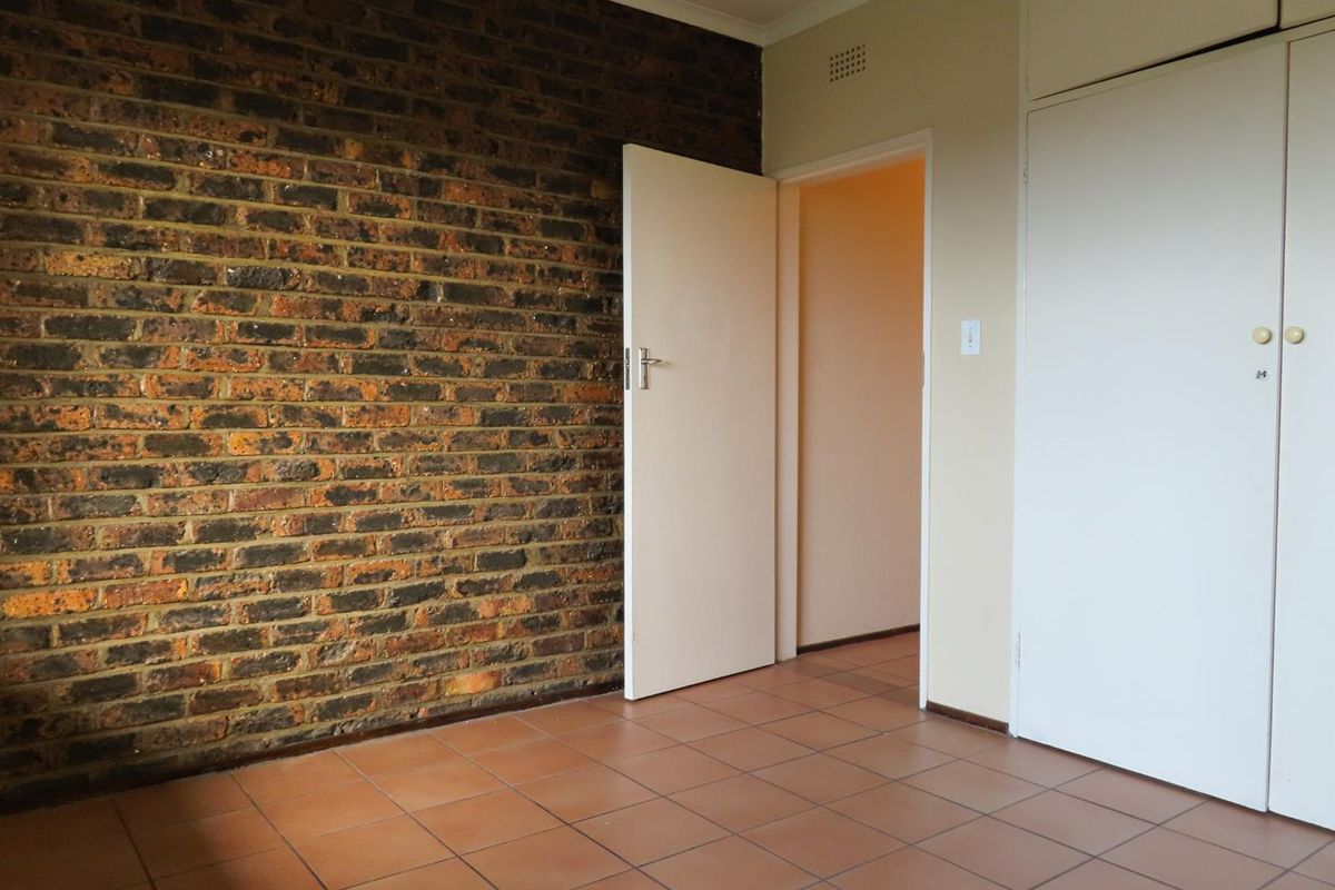 Sunny 2-Bedroom Home with Balcony in Well-Maintained Complex - Photo 5