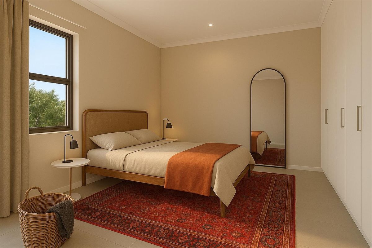A well-lit bedroom featuring neutral walls, tiled flooring, and built-in floor-to-ceiling wardrobes, offering a clean and modern living space.