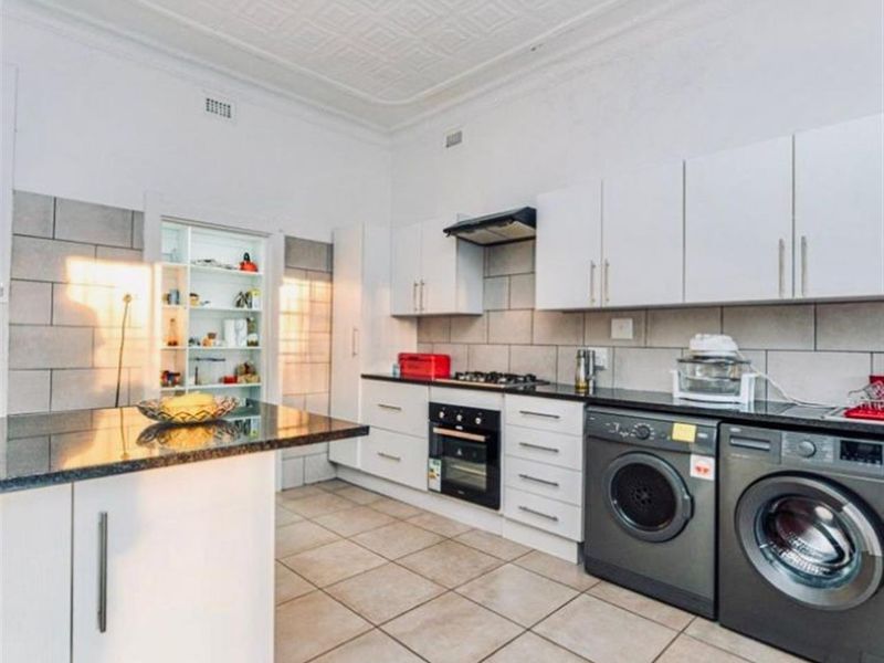 Spacious Renovated 3-Bedroom Home with Large Yard, Garage and Extra Cottage Space: Krugersdorp North - Photo 6