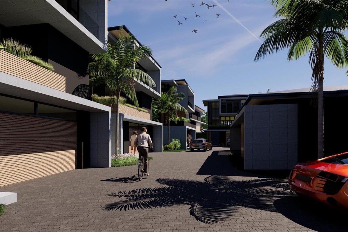 A modern residential complex featuring contemporary architectural design, paved driveways, and integrated balconies within a landscaped estate setting.