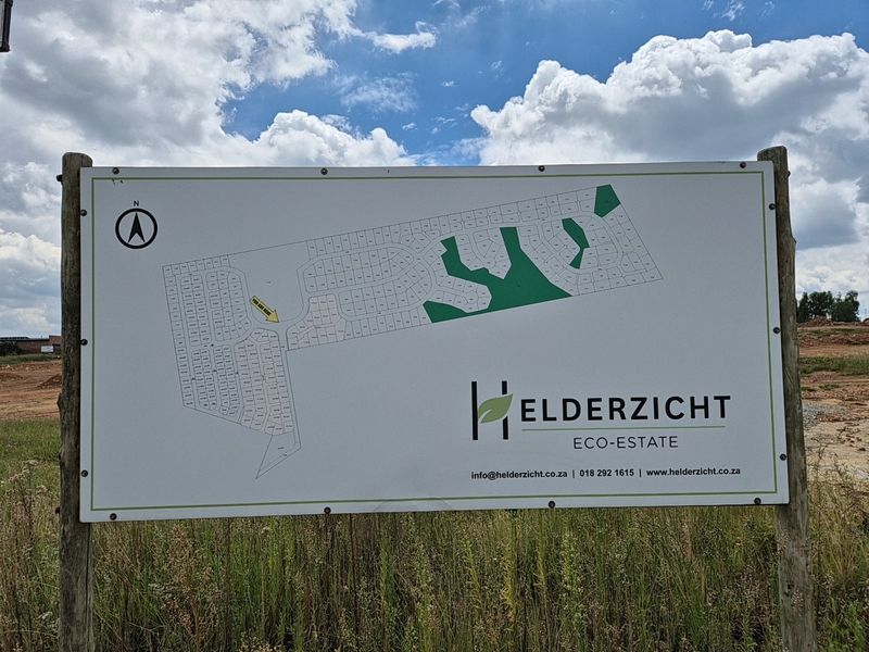 A site map signage board for Helderzicht Eco-Estate, displaying the residential layout and current location within the development.