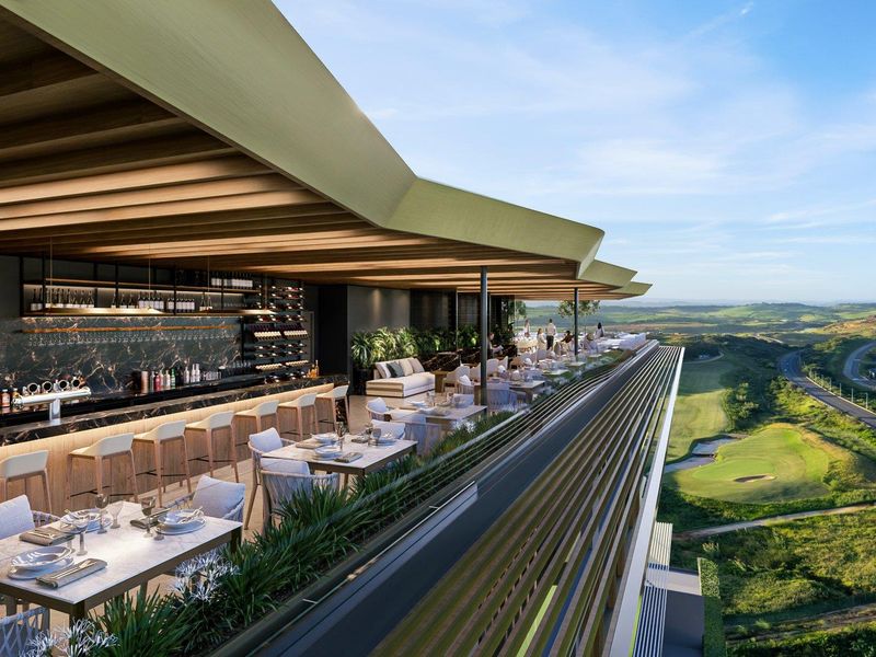 A sophisticated open-air bar and dining terrace featuring modern architectural design, integrated bar cabinetry, and expansive views over the surrounding landscape.