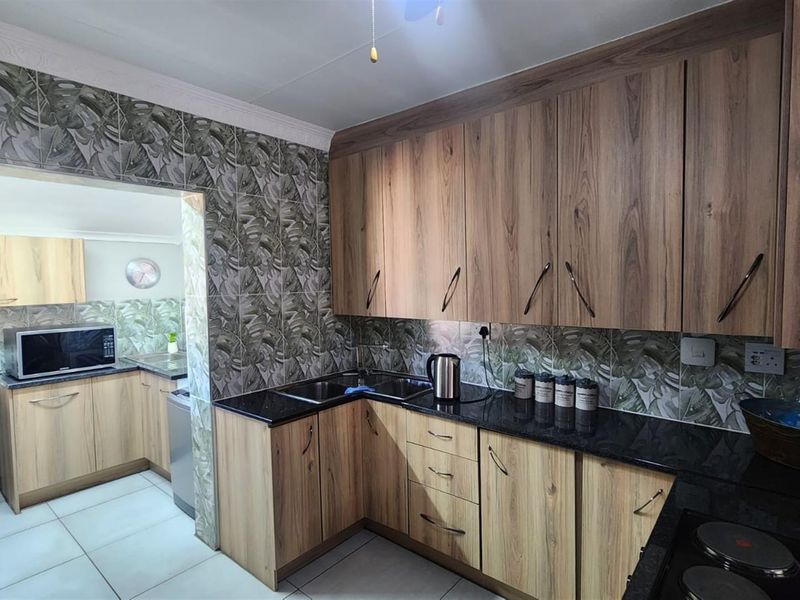 Stylish and Secure Living in Pin Oaks - Photo 9