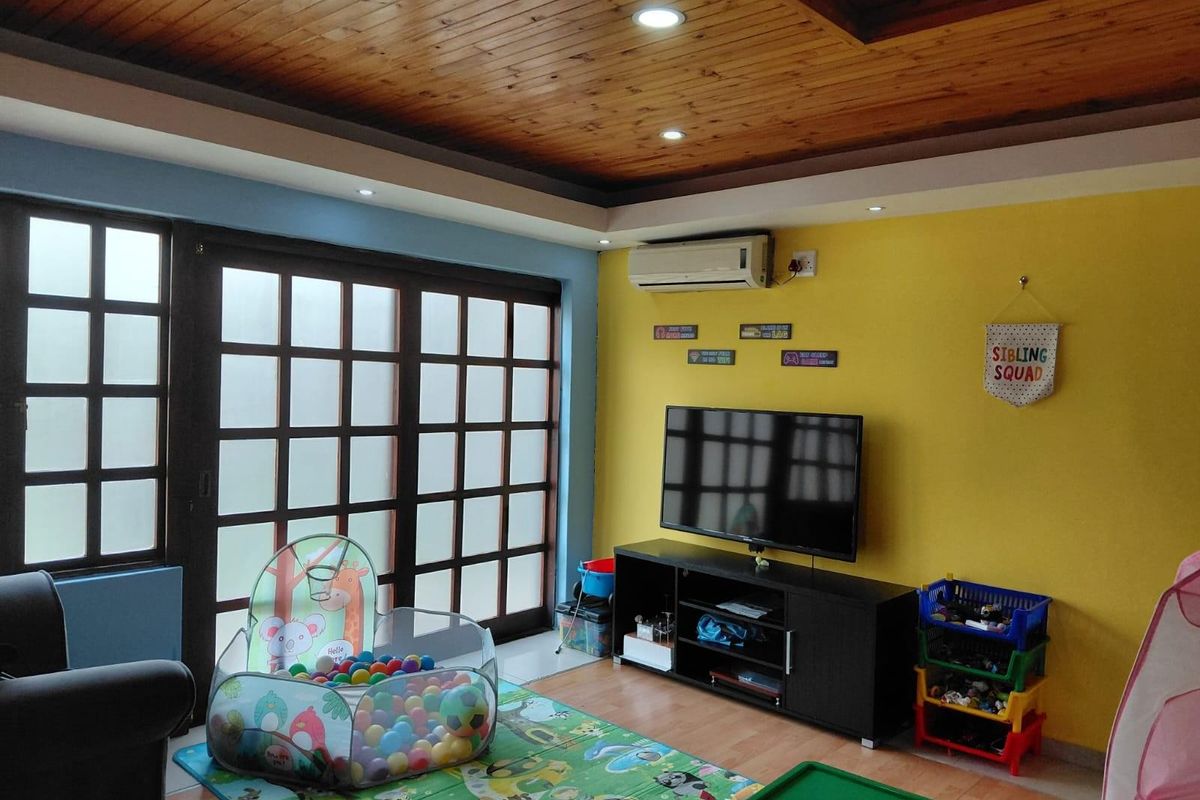 A living room featuring a timber-paneled ceiling with recessed lighting, laminate flooring, and large sliding glass doors leading to an outdoor area.