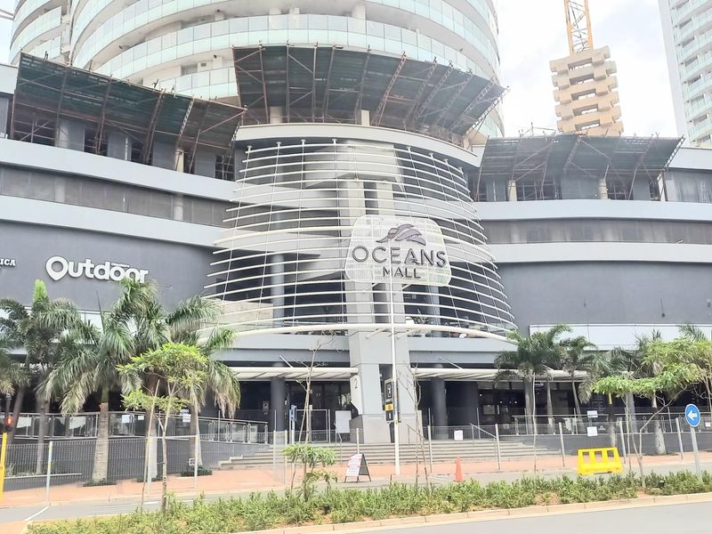 Exterior view of the modern Oceans Mall facade, featuring contemporary architectural design, glass elements, and integrated commercial signage.