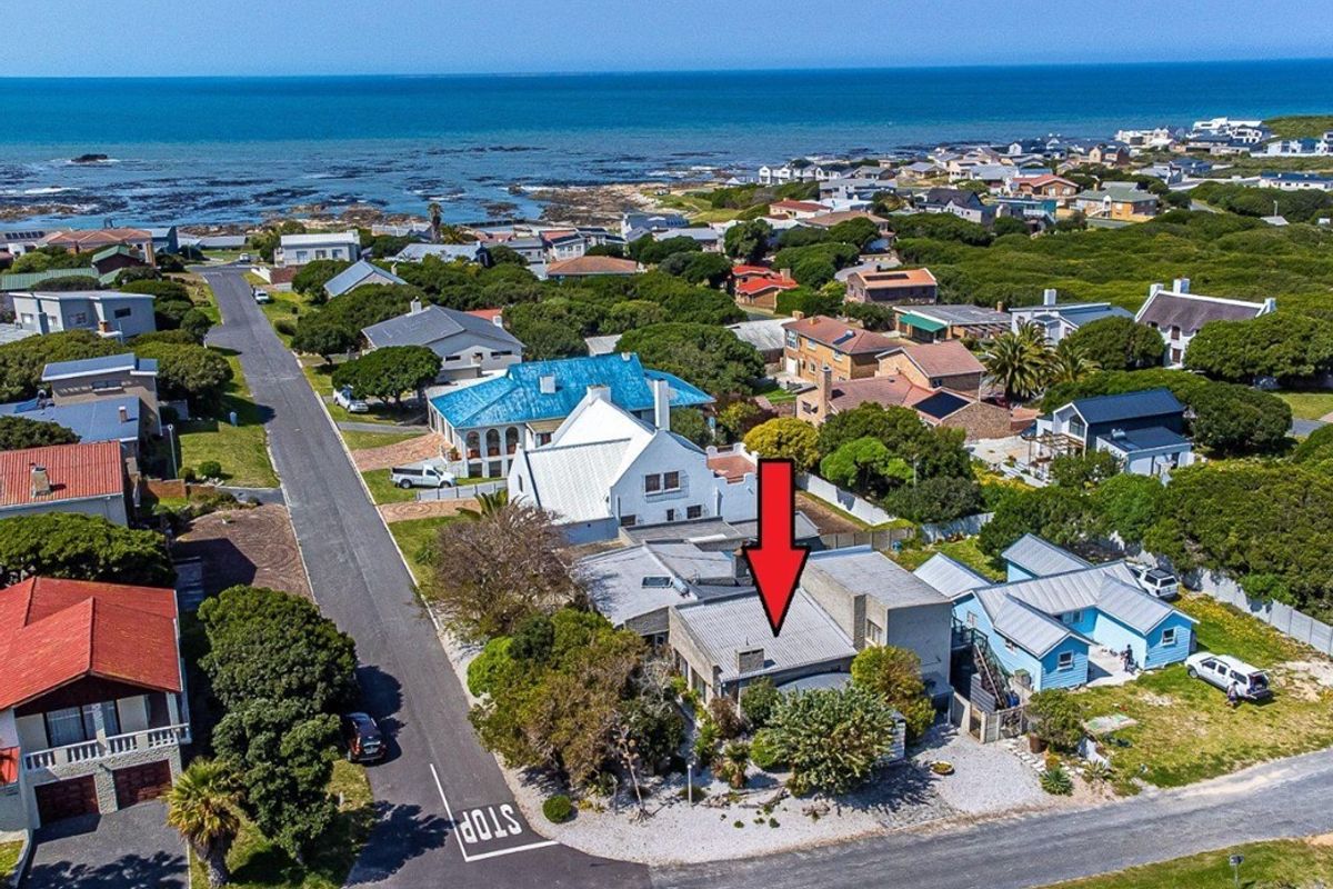 Aerial view of the coastal property, highlighting its location within the neighbourhood and proximity to the ocean.