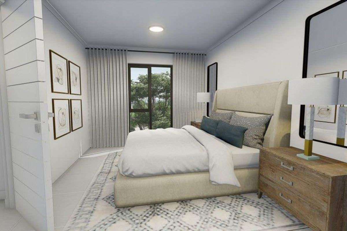 A modern, well-lit bedroom featuring neutral tones, tiled flooring, and large windows with floor-to-ceiling curtains, creating a bright and inviting atmosphere.