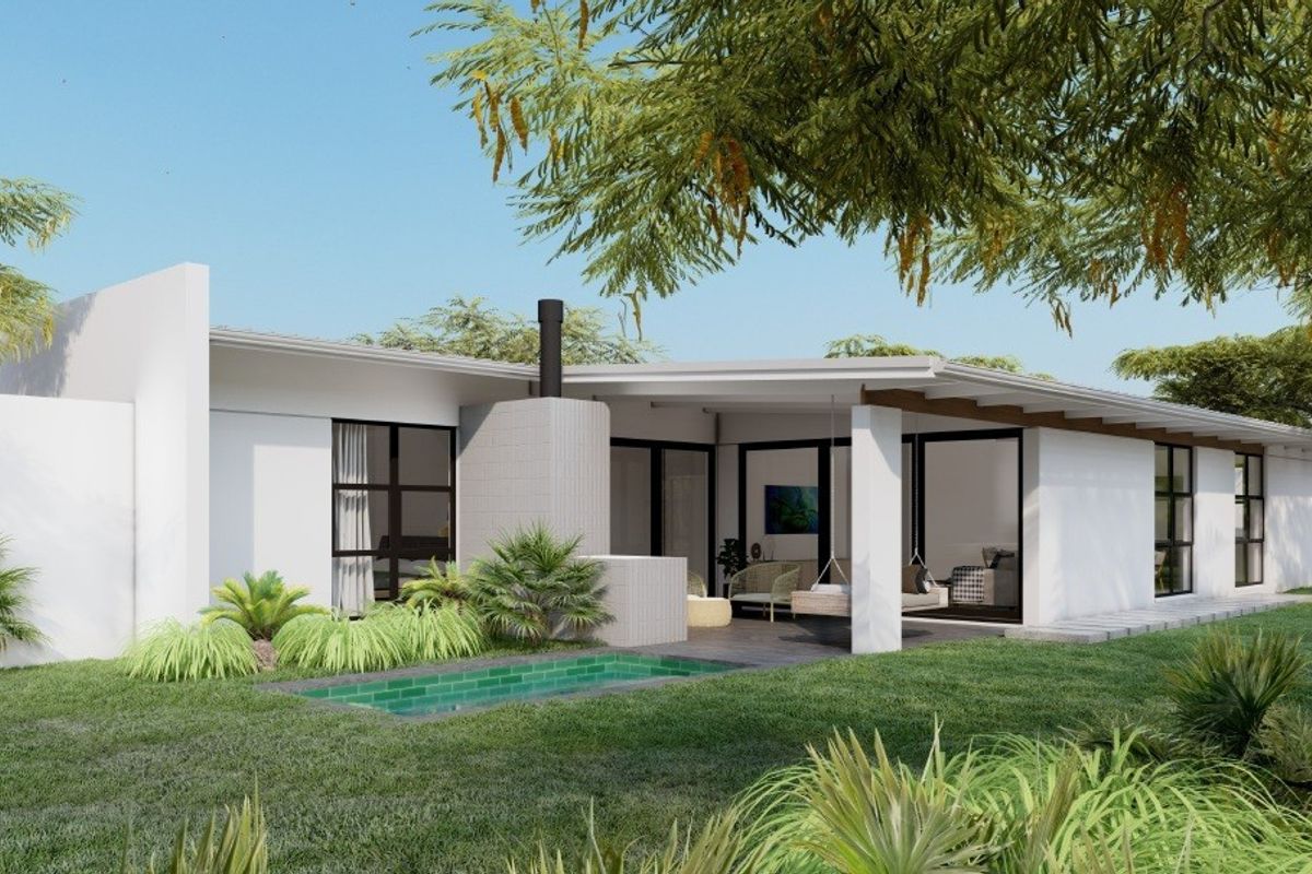 Rear exterior view featuring a modern covered patio, outdoor fireplace, and a swimming pool set within a landscaped garden.