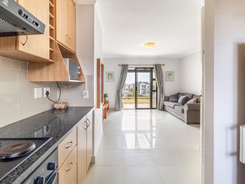 Top Floor Living with Elevated Views and The Balcony Everyone Wants - Photo 3