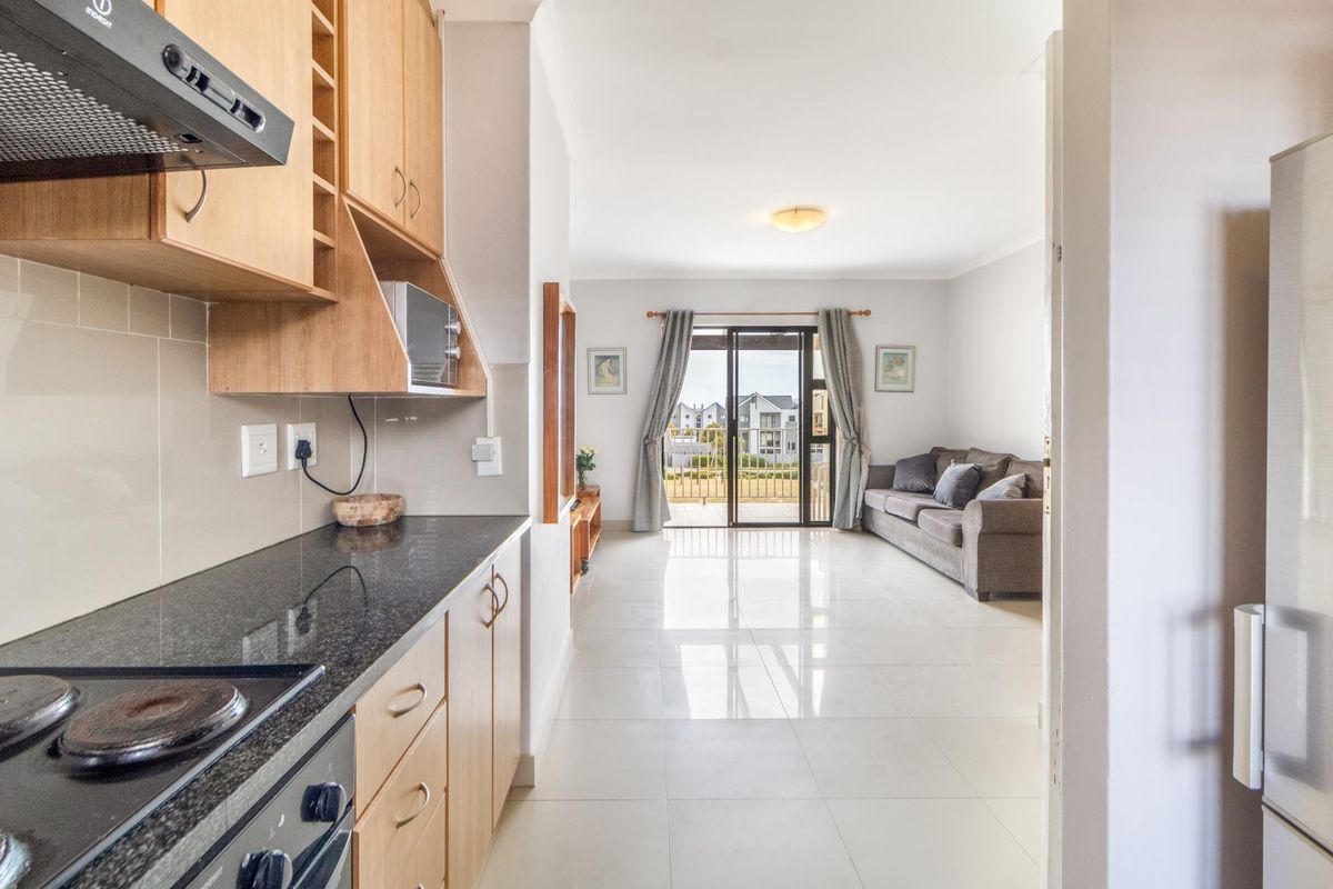 Top Floor Living with Elevated Views and The Balcony Everyone Wants - Photo 3