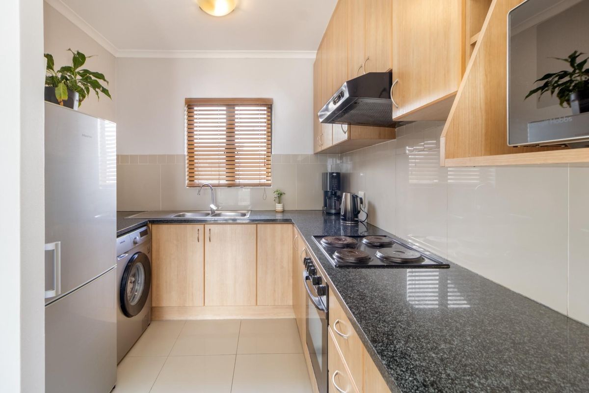 Top Floor Living with Elevated Views and The Balcony Everyone Wants - Photo 2