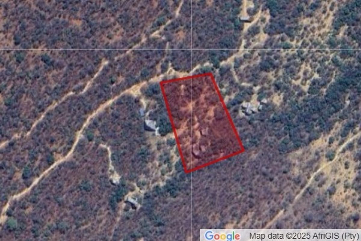 An aerial view showing the property boundary outline over a natural, undeveloped landscape.