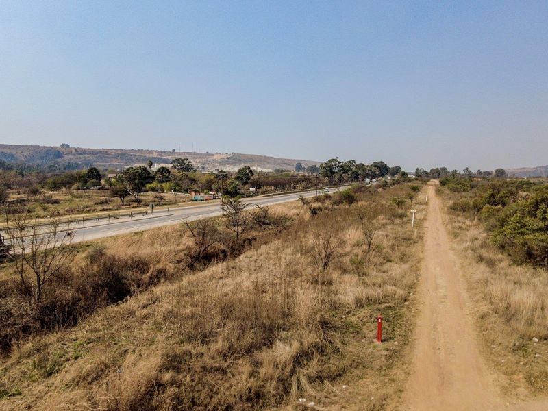 Six hectares level plot adjacent to ahighway and a busy arterial route in a fast-developing area - Photo 1