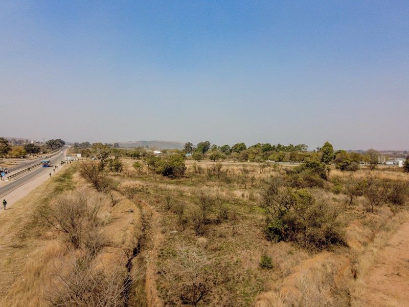 Earmarked for rezoning to a fuel outlet - five hectares level plot on corner of highway - Photo 6