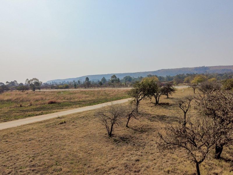 Earmarked for rezoning to a fuel outlet - five hectares level plot on corner of highway - Photo 1