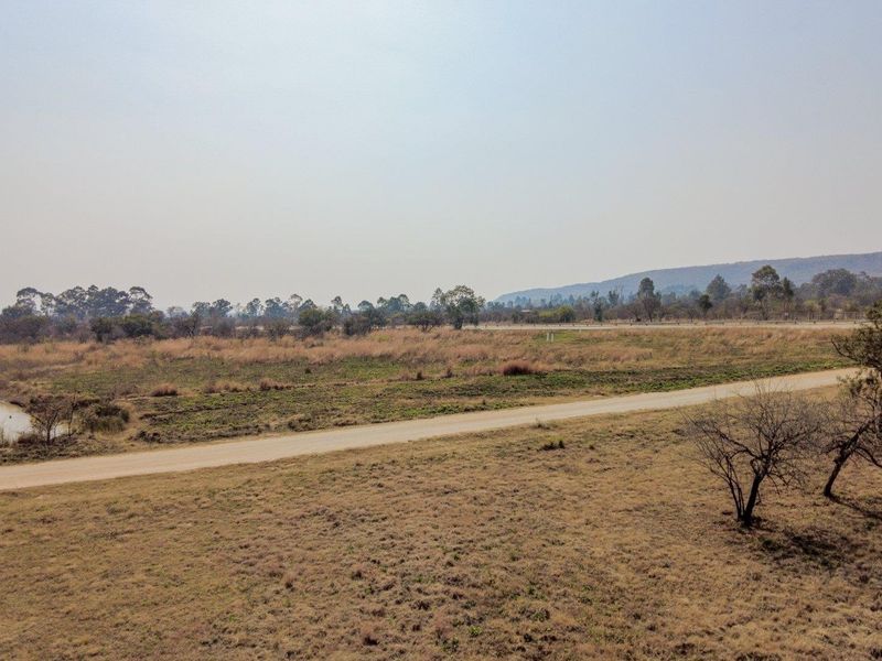 Earmarked for rezoning to a fuel outlet - five hectares level plot on corner of highway - Photo 2