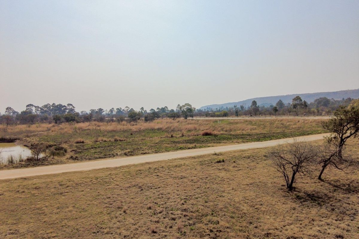 Earmarked for rezoning to a fuel outlet - five hectares level plot on corner of highway - Photo 2