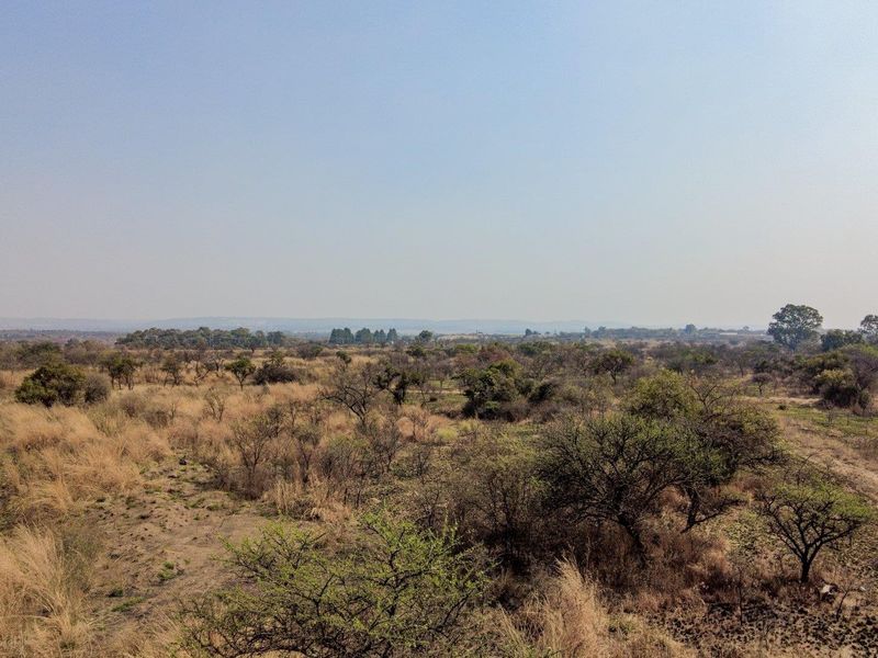 Earmarked for rezoning to a fuel outlet - five hectares level plot on corner of highway - Photo 3