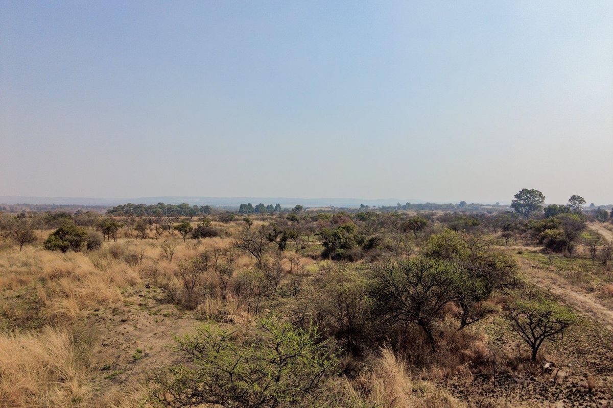 Earmarked for rezoning to a fuel outlet - five hectares level plot on corner of highway - Photo 3