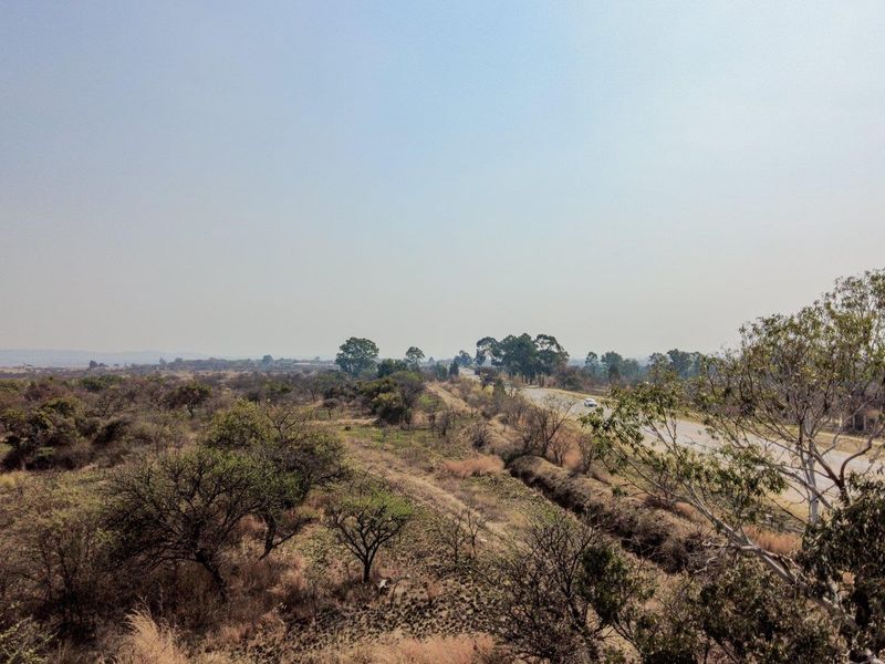 Earmarked for rezoning to a fuel outlet - five hectares level plot on corner of highway - Photo 4