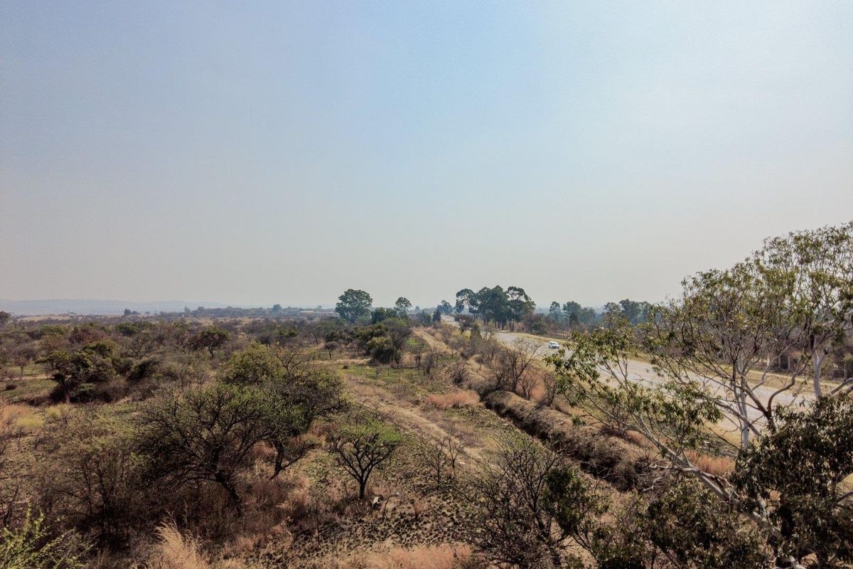 Earmarked for rezoning to a fuel outlet - five hectares level plot on corner of highway - Photo 4