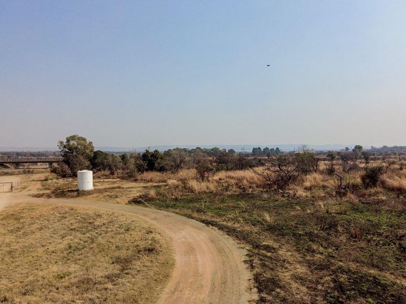 Earmarked for rezoning to a fuel outlet - five hectares level plot on corner of highway - Photo 5