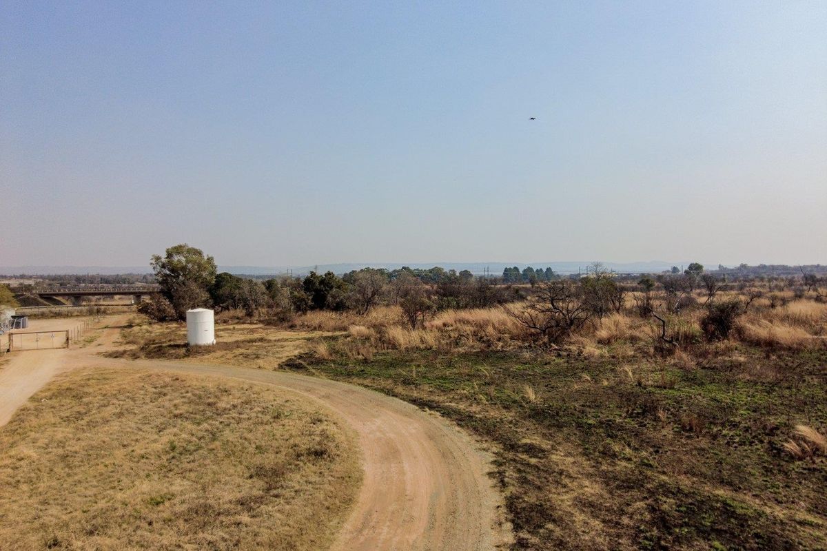 Earmarked for rezoning to a fuel outlet - five hectares level plot on corner of highway - Photo 5