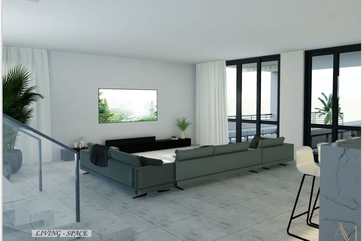 Modern open-plan living area featuring large glass sliding doors, tiled flooring, and a contemporary staircase design.