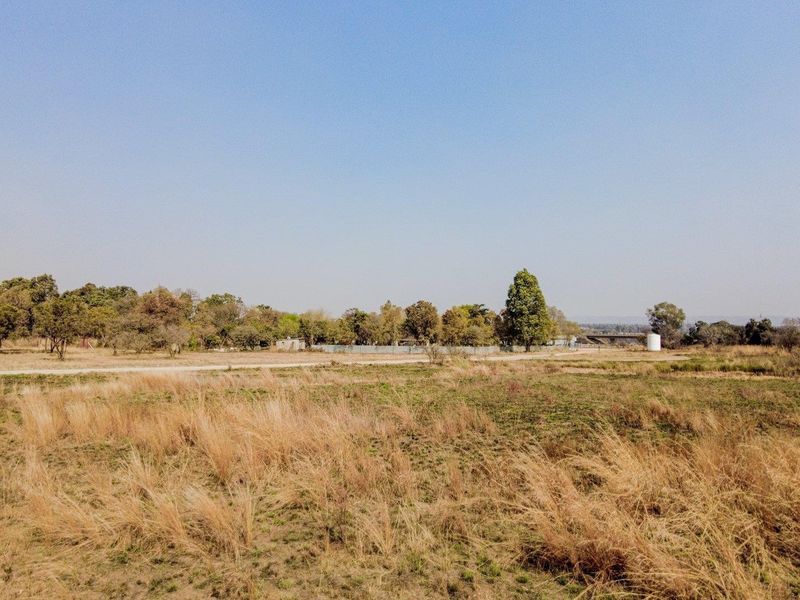 Five hectares level plot on corner of highway and a busy arterial route in a fast-developing area - Photo 3
