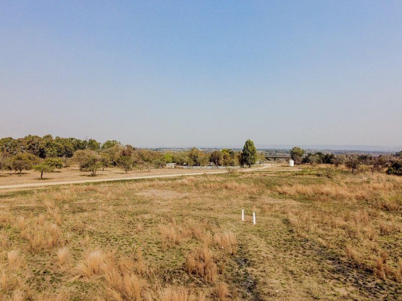 Five hectares level plot on corner of highway and a busy arterial route in a fast-developing area - Photo 2