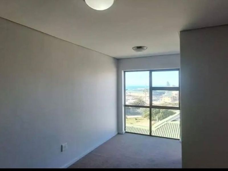 Spacious Coastal Living with Sea View Apartment - Photo 10