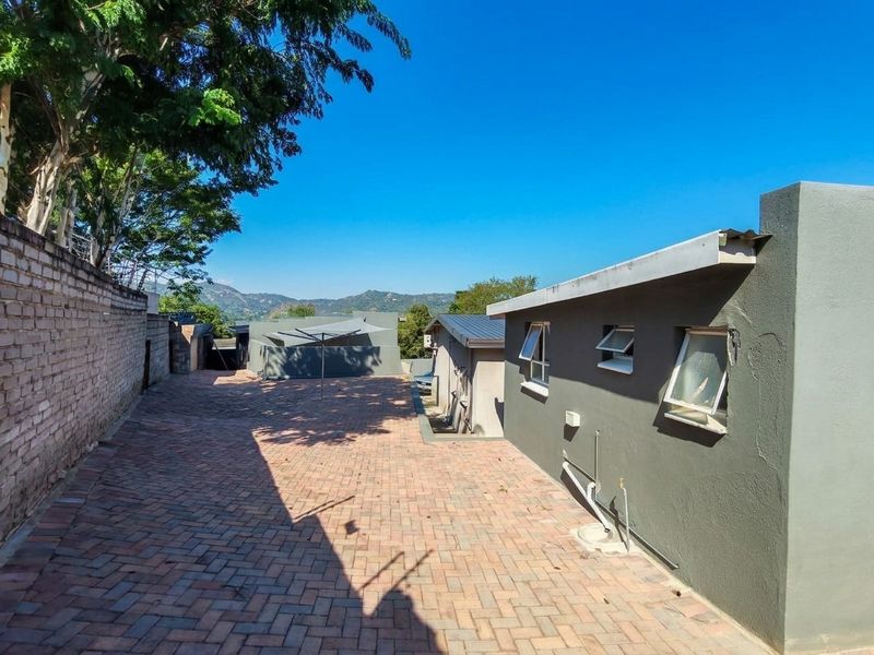 Exceptional Family Home with Pool, Entertainment Areas and Modern Comforts in Nelspruit Ext 5 - Photo 6