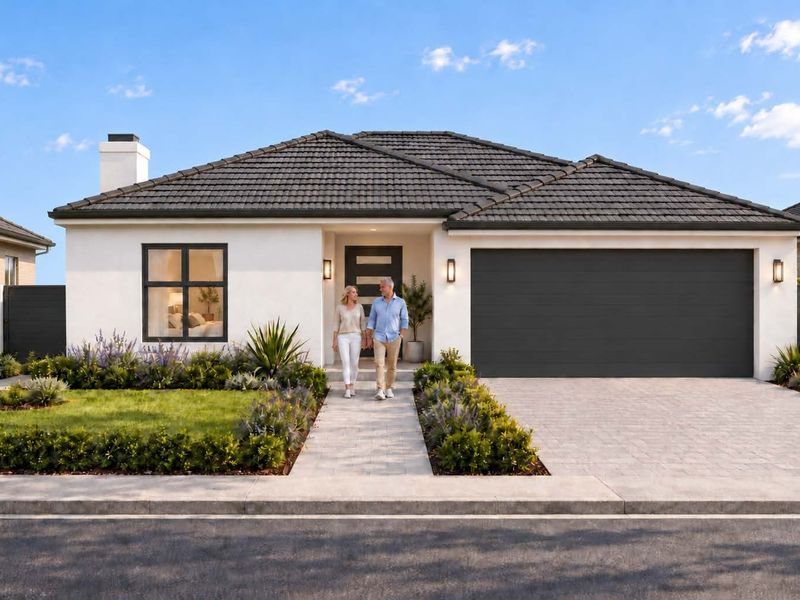 Modern single-story residential home featuring a tiled roof, double garage, paved driveway, and landscaped front garden.