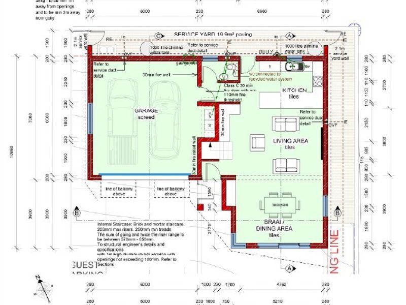 A detailed ground floor architectural plan showing the layout of the garage, kitchen, living area, dining space, and service yard.